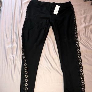 Bebe leggings with ring detail on the sides